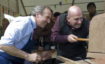 Peter Greig and Simone Brogi feed the oven